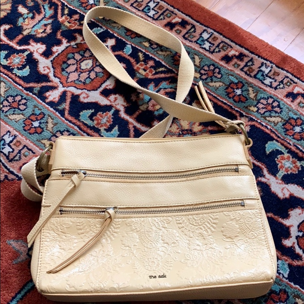 Adorable butter yellow cross body purse. The sak.